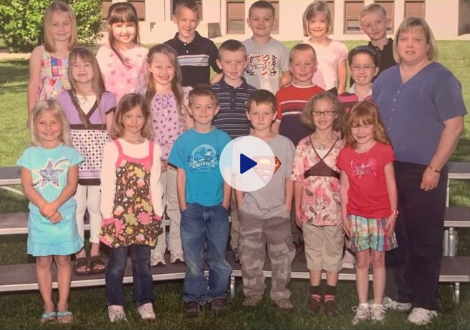 a group of young kids with a teacher